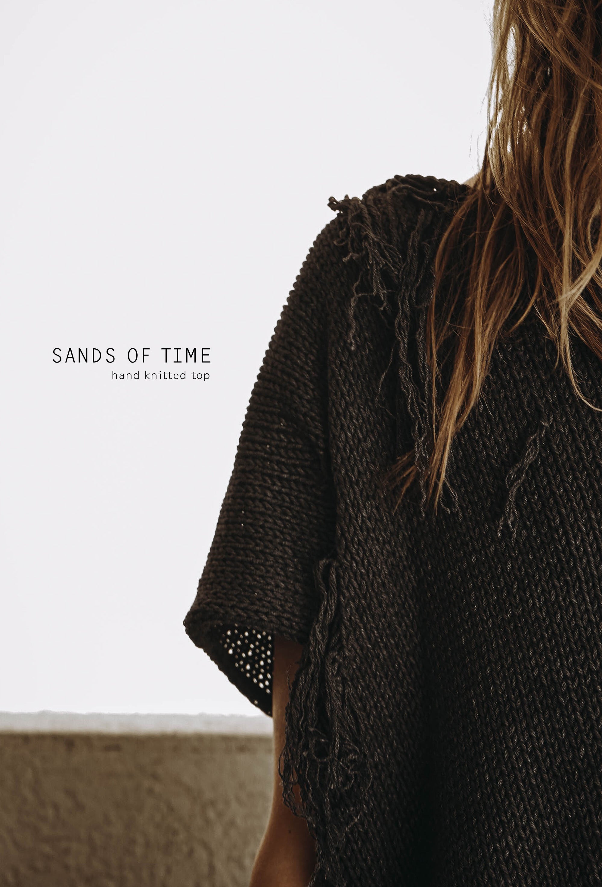Distressed cotton sweater