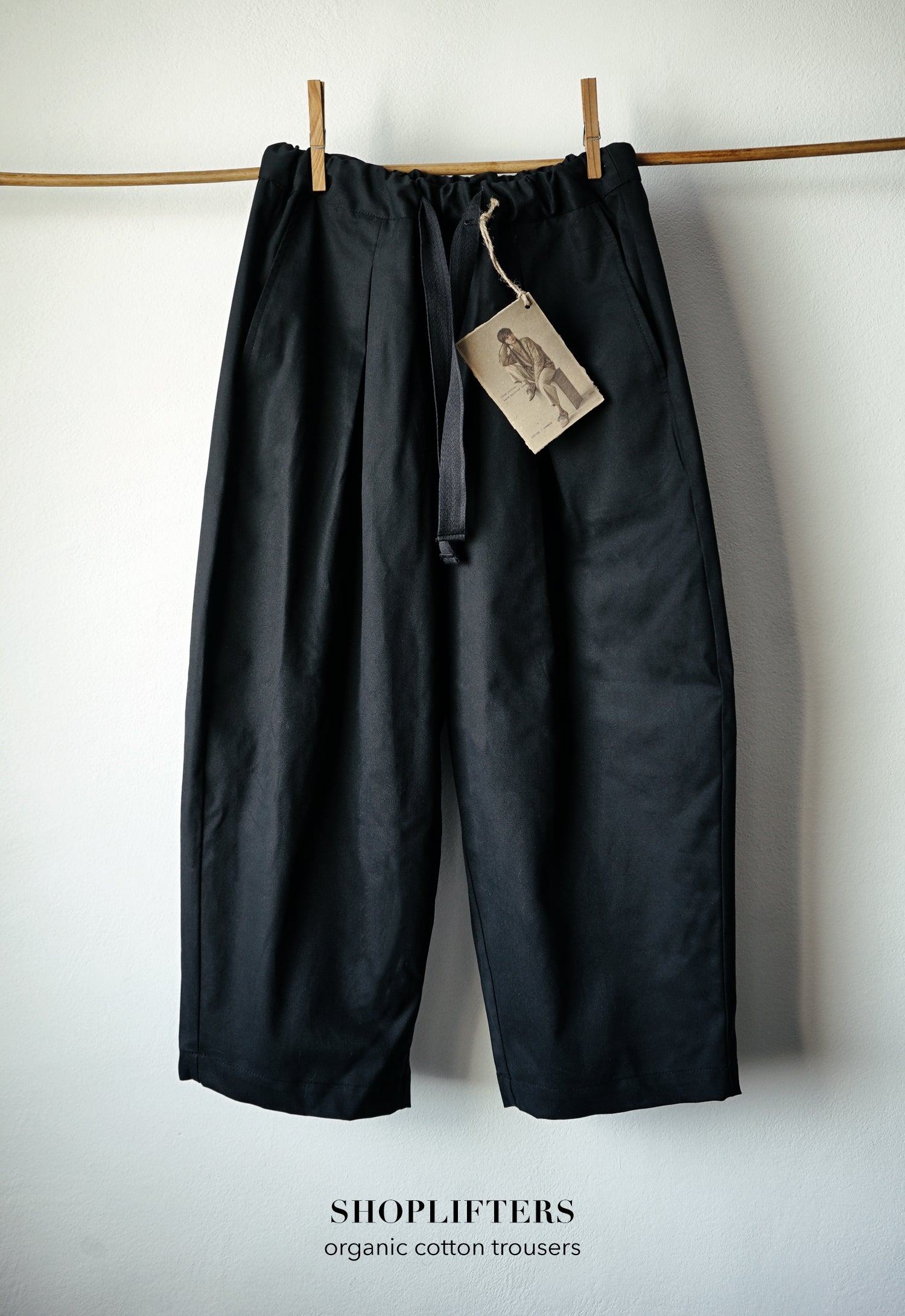 SHOPLIFTERS PLEATED TROUSERS